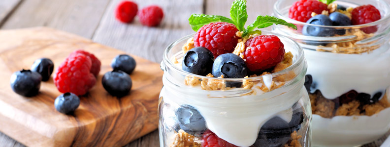 greek yogurt parfait with granola, blueberries, and raspberries