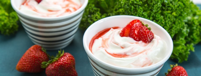 yogurt with a fresh sliced strawberry