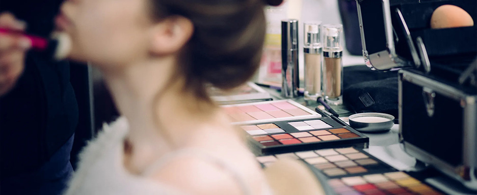 Woman getting her makeup done.