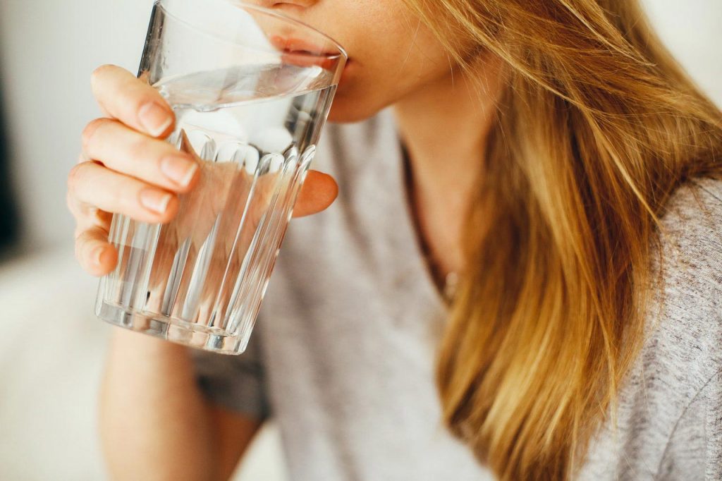 drinking plenty of water will help reduce swelling around the eyes