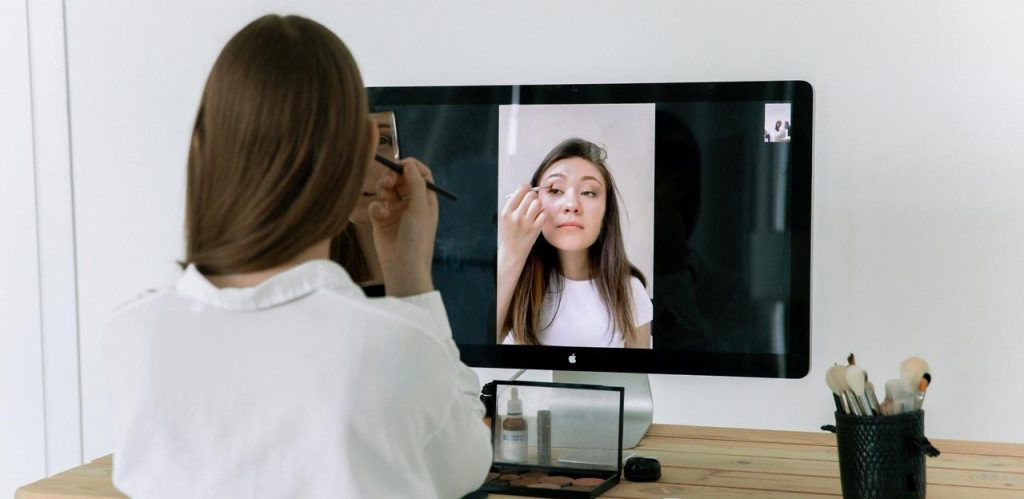 Woman recording video filled with beauty tips