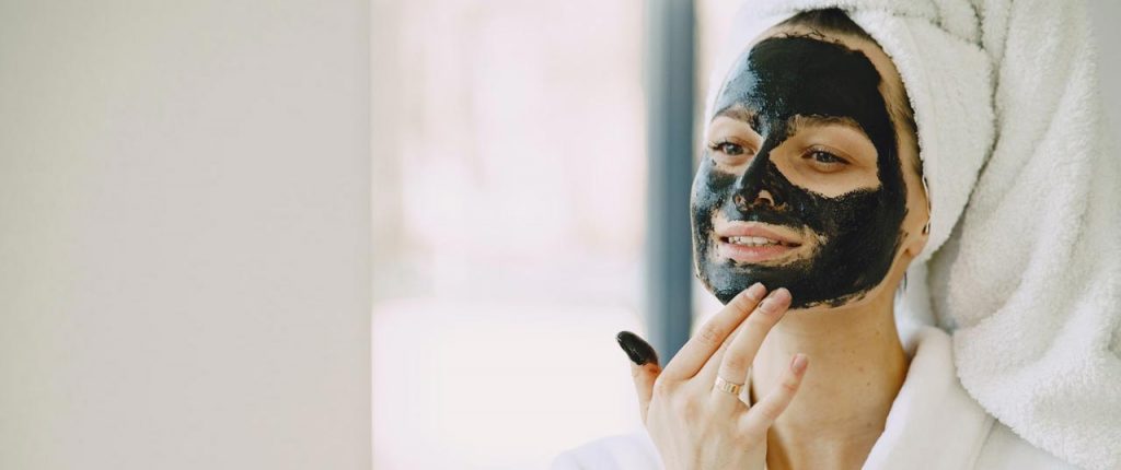 Woman with black facial mask